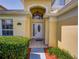 Welcoming entryway with a tiled floor and an elegant front door at 1049 Lake Berkley Dr, Kissimmee, FL 34746