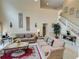 Bright and spacious living room with comfortable seating and high ceilings at 1049 Lake Berkley Dr, Kissimmee, FL 34746