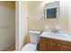 Clean bathroom with a walk-in shower, toilet and vanity at 7819 Puritan Rd, Orlando, FL 32807