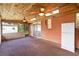 Spacious screened porch with wood ceiling, fans, and brick wall at 7819 Puritan Rd, Orlando, FL 32807