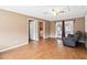 Spacious Gathering room with sliding glass doors and wood-look tile floor at 7819 Puritan Rd, Orlando, FL 32807