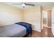 Spacious bedroom with wood floors and access to bathroom at 7819 Puritan Rd, Orlando, FL 32807