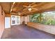 Enclosed porch with wood ceiling, two ceiling fans, and French doors at 7819 Puritan Rd, Orlando, FL 32807