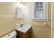Simple bathroom with single sink vanity and window at 7819 Puritan Rd, Orlando, FL 32807