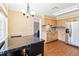 Kitchen features black granite table and stainless steel appliances at 7819 Puritan Rd, Orlando, FL 32807