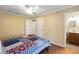 Bedroom with wood-look tile floors and adjacent bathroom at 7819 Puritan Rd, Orlando, FL 32807
