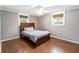 Cozy bedroom with hardwood floors and neutral decor at 7819 Puritan Rd, Orlando, FL 32807