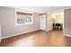 Living room with tile floors, built-in shelving, and dining area at 7819 Puritan Rd, Orlando, FL 32807