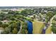 Aerial view of a neighborhood with waterway and park at 7819 Puritan Rd, Orlando, FL 32807