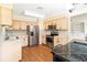 Eat-in kitchen with stainless steel appliances and wood floors at 7819 Puritan Rd, Orlando, FL 32807