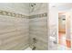 Modern bathroom with a shower/tub combo and tile surround at 7819 Puritan Rd, Orlando, FL 32807