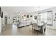 Light and airy dining room with a wood dining table and white chairs at 1294 Harbor Ridge Dr, Kissimmee, FL 34759