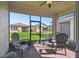 Relaxing screened patio with brick flooring and comfortable outdoor seating at 1294 Harbor Ridge Dr, Kissimmee, FL 34759