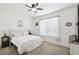 Bright bedroom with a king-size bed, ceiling fan and large window with blinds at 1294 Harbor Ridge Dr, Kissimmee, FL 34759