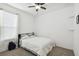 Cozy bedroom with a queen bed, ceiling fan and window with blinds at 1294 Harbor Ridge Dr, Kissimmee, FL 34759