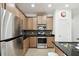 Modern kitchen with stainless steel appliances and dark countertops at 1294 Harbor Ridge Dr, Kissimmee, FL 34759