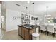 Open concept kitchen with island and stainless steel appliances at 1294 Harbor Ridge Dr, Kissimmee, FL 34759