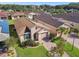 Aerial view of single-Gathering home with solar panels and paved driveway at 1294 Harbor Ridge Dr, Kissimmee, FL 34759