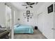 Bright bedroom with a queen bed, ceiling fan, and double door closet at 1294 Harbor Ridge Dr, Kissimmee, FL 34759