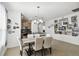 Bright dining room features a long wooden table with white chairs at 1294 Harbor Ridge Dr, Kissimmee, FL 34759