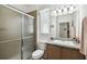 Clean bathroom with a shower/tub combo, vanity, and single sink at 1294 Harbor Ridge Dr, Kissimmee, FL 34759