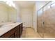Bathroom with double vanity, large mirror, and a separate shower at 794 Citrus Isle Dr, Davenport, FL 33837