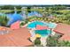 Community pool with shaded areas at 341 Navarra Ln, Davenport, FL 33837