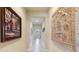 Bright hallway featuring decorative wall art and tile flooring at 341 Navarra Ln, Davenport, FL 33837