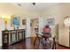 Home office with hardwood floors, a glass desk, and built-in shelving at 341 Navarra Ln, Davenport, FL 33837