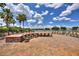 Relaxing fire pit area with seating overlooking a lake at 341 Navarra Ln, Davenport, FL 33837
