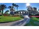 Gated community entrance with water feature and landscaping at 341 Navarra Ln, Davenport, FL 33837