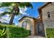 Inviting front entrance with stone accents and lush landscaping at 341 Navarra Ln, Davenport, FL 33837