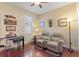 Cozy sitting room featuring comfortable seating and hardwood floors at 341 Navarra Ln, Davenport, FL 33837