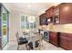 Bright breakfast nook with a glass table and chairs, providing a lovely view at 341 Navarra Ln, Davenport, FL 33837