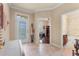 Inviting entryway with tile floors and views into an office and bathroom at 341 Navarra Ln, Davenport, FL 33837
