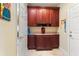 Laundry room with wooden cabinets and countertop space at 341 Navarra Ln, Davenport, FL 33837