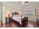 Comfortable bedroom with hardwood floors, and ample natural light at 341 Navarra Ln, Davenport, FL 33837