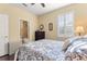 Charming bedroom with a queen-size bed and an ensuite bathroom at 341 Navarra Ln, Davenport, FL 33837