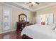 Bright main bedroom with hardwood floors and a large dresser at 341 Navarra Ln, Davenport, FL 33837