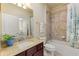 Clean bathroom with a bathtub, shower, and granite countertop at 341 Navarra Ln, Davenport, FL 33837