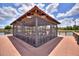 Screened gazebo with seating on a lakefront deck at 341 Navarra Ln, Davenport, FL 33837