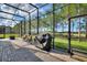 Relaxing screened patio with outdoor seating and grill at 341 Navarra Ln, Davenport, FL 33837