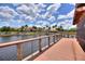 Wooden deck and gazebo overlooking lake and clubhouse at 341 Navarra Ln, Davenport, FL 33837
