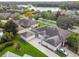 An aerial view showcasing a single-Gathering home with a large backyard and driveway at 123 Gulf Dr, Kissimmee, FL 34759