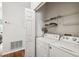 Laundry room with washer, dryer, and shelving at 123 Gulf Dr, Kissimmee, FL 34759