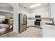 Modern kitchen featuring stainless steel appliances and white cabinetry at 123 Gulf Dr, Kissimmee, FL 34759