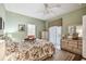 Main bedroom with floral bedding and access to the backyard at 123 Gulf Dr, Kissimmee, FL 34759