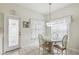 Kitchen breakfast nook with glass-top table and four chairs at 123 Gulf Dr, Kissimmee, FL 34759