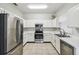 Efficient kitchen with stainless steel appliances and ample counter space at 123 Gulf Dr, Kissimmee, FL 34759