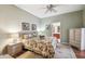 Spacious bedroom with floral bedding and en-suite bathroom access at 123 Gulf Dr, Kissimmee, FL 34759